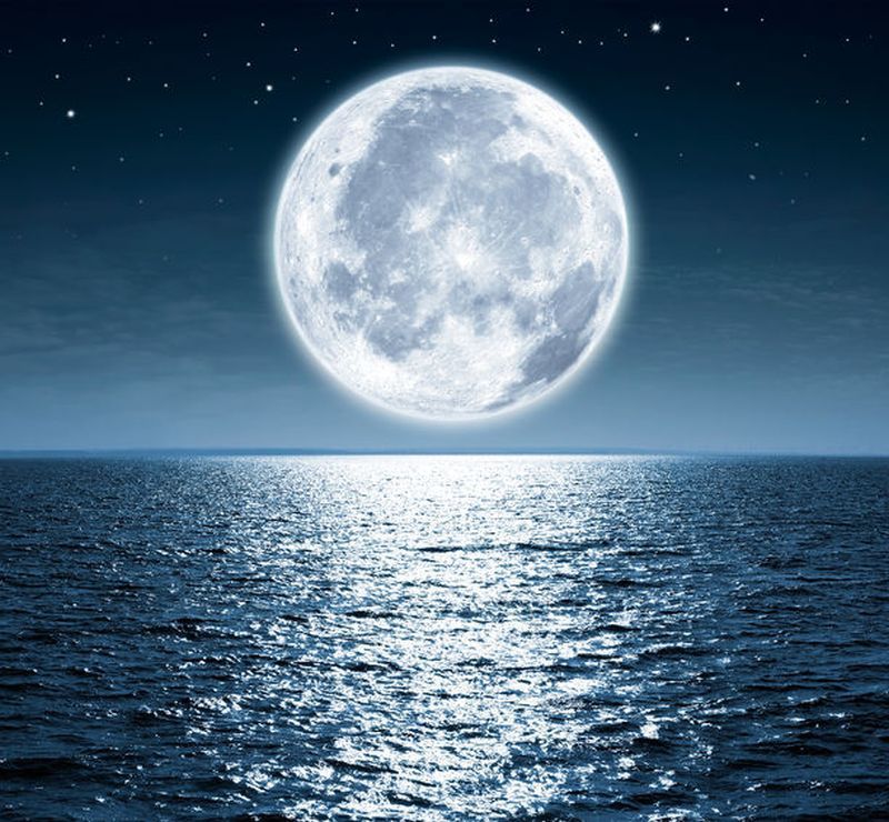 50220944 - full moon rising over the ocean empty at night with copy space